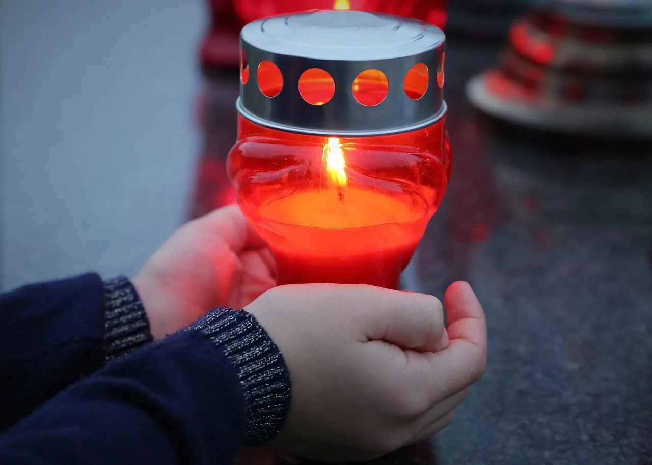 stop adult suicide, candle in child hands, left alone, emotional trauma, traumatic, condolence, mourning, sadness, remembering, grave, cemetery, outdoor. Fake Appeals in “Actors Who Died This Week” Searches