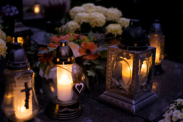 Lanterns with candles illuminate a cemetery on All Saints' Day. How to make sense of deaths by month causes